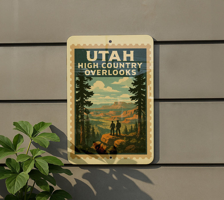 A vintage-style sign for the High Country Overlooks in Utah, featuring a scenic landscape with mountains, pine trees, and two people standing on a rock.