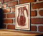 A red and white sign featuring a coffee mug illustration is mounted on a brick wall.