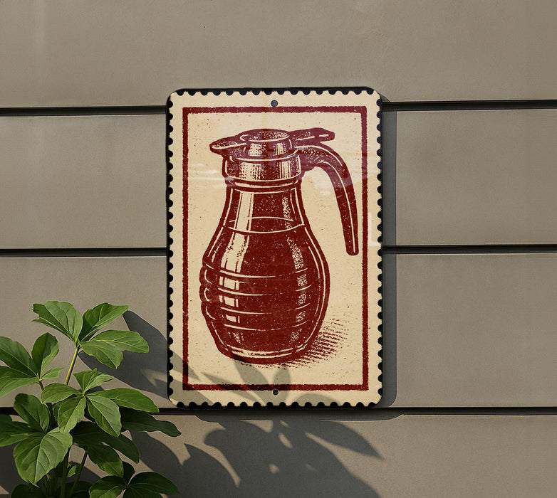 a red and white sign with a picture of a coffee pot or kettle on it, mounted on a wall.