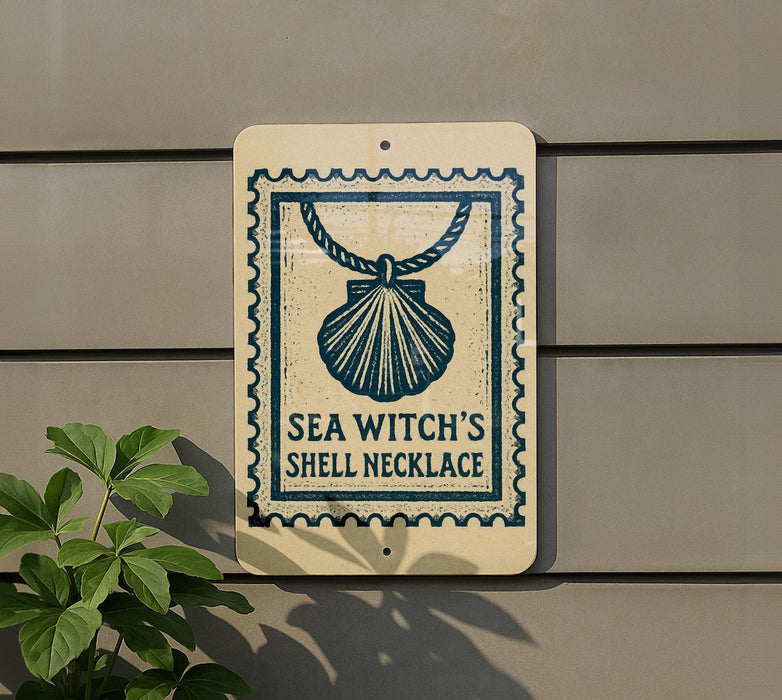 a sign with a seashell design and the text "SEA WITCH'S SHELL NECKlace" on it, mounted on a wall.