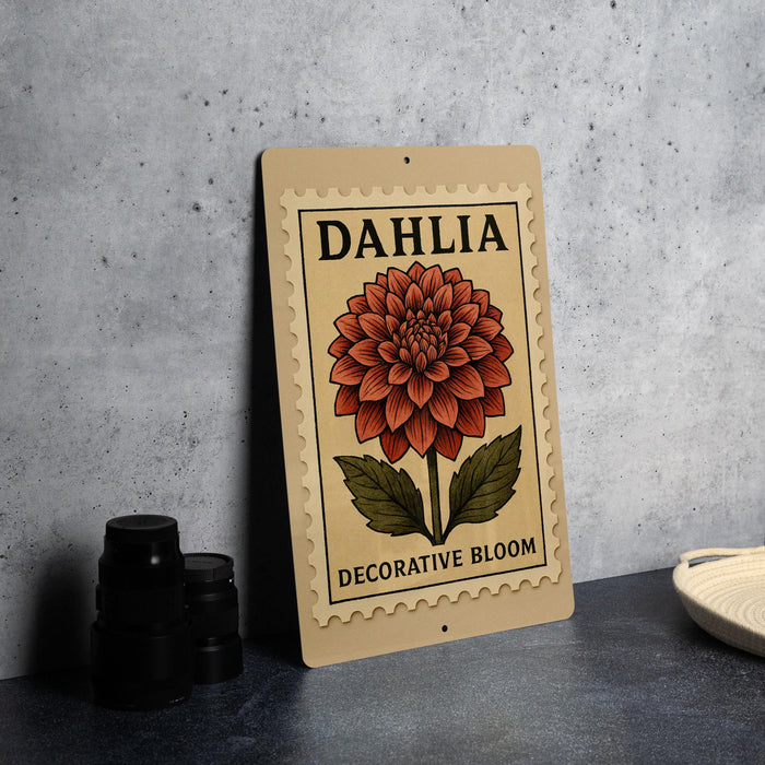 a decorative bloom sign with the word "Dahlia" on it, placed on a table next to some black camera lenses.
