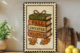 a decorative sign with a stack of books and autumn leaves, accompanied by the phrase "FALL WEATHER" on a wooden shelf.