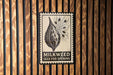 a seed pod opening sign with the text "MILKWEED SEED POD OPENING" displayed prominently.
