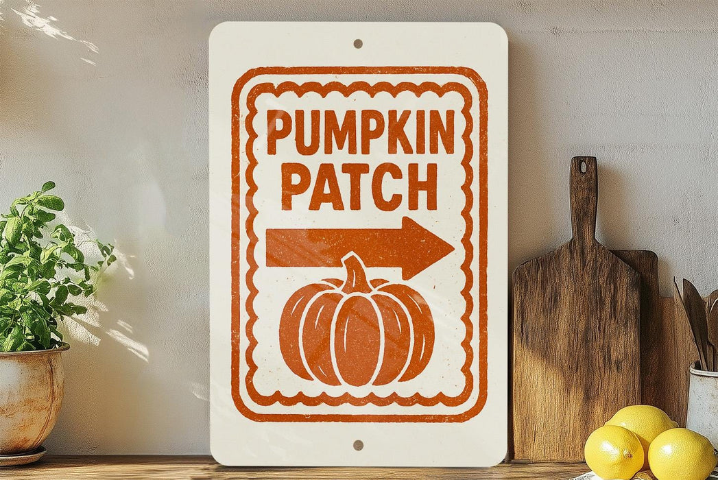 a sign that reads "Pumpkin Patch" with an arrow pointing to the right, placed on a shelf next to a wooden cutting board and some lemons.