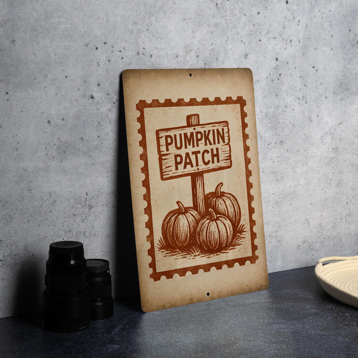 a sign that reads "Pumpkin Patch" with illustrations of pumpkins and a wooden post.