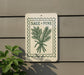 a sign with the text "SAGE + PINE" and a graphic of a plant, mounted on a wall.