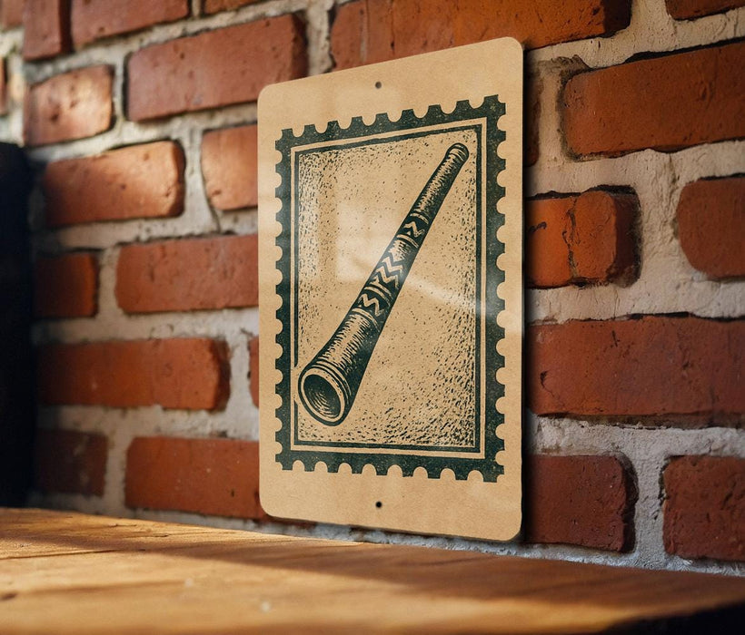 a wooden table with a framed illustration of a pipe on it, mounted on a brick wall.