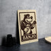 a sign with a cartoon banjo character playing the banjo, and the word "BANJO" is written below the banjo.