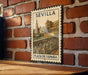 A vintage-style metal sign with the text "SEVILLA" and "PLAZA DE ESPAÑA" is displayed on a brick wall.