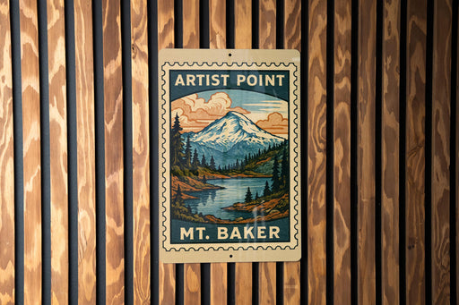 A vintage-style metal sign with a mountain landscape and a river, mounted on a wooden wall.