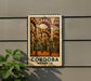 a metal sign with a decorative border, displaying a painting of a building with arched windows and columns.