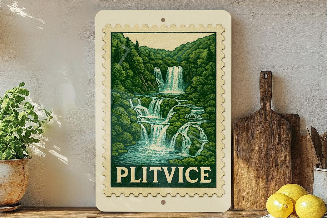 A framed print of a waterfall scene hangs on a wall, surrounded by kitchen utensils and a potted plant.