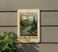 A vintage-style sign for the Alpine Lakes basin in California, featuring a scenic illustration of mountains, trees, and a lake.
