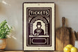 a vintage-style sign with the word "TICKETS" prominently displayed, along with an illustration of a ticket booth or ticket seller. The sign is placed on a wooden surface, with a potted plant to the left and a wooden cutting board to the right. There are also some lemons visible in the image.