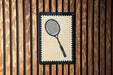 A tennis racket is depicted on a wooden wall, framed within a decorative border.