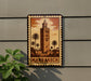A decorative sign featuring an illustration of a tall tower surrounded by palm trees, with the word "MARAKECH" prominently displayed.