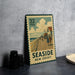 A vintage seaside postage stamp from New Jersey, featuring a wooden pier and people walking along it.