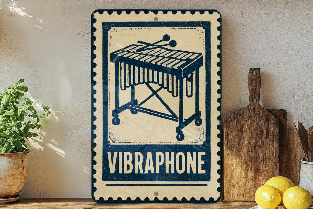 a vintage-style metal sign with a musical instrument design, placed on a wooden surface next to a wooden cutting board and a potted plant.