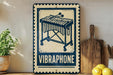 a vintage-style metal sign with a musical instrument design, placed on a wooden surface next to a wooden cutting board and a potted plant.