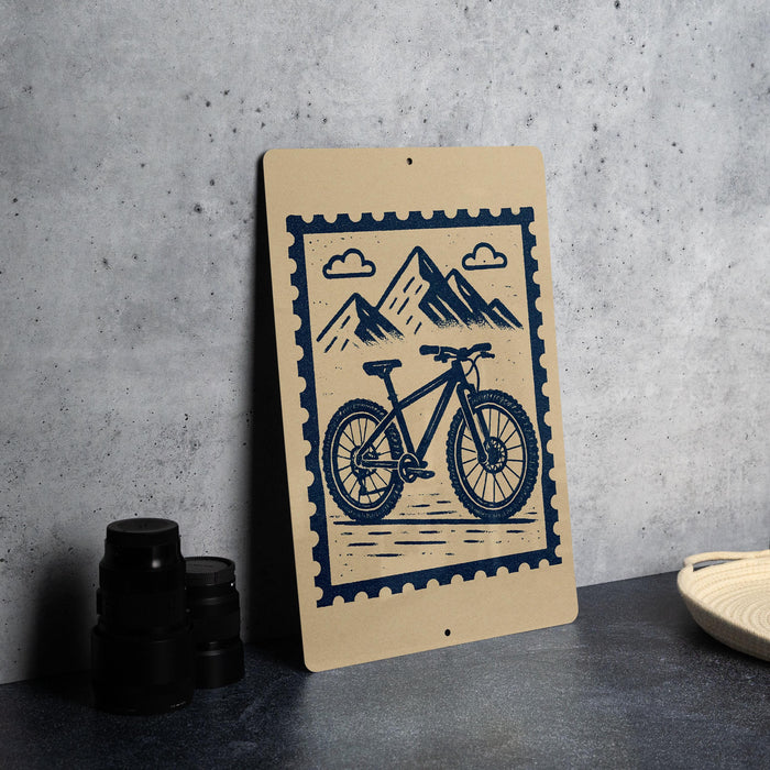 a wooden sign with a bicycle illustration on it, placed on a table next to some black camera lenses.