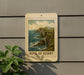 A framed image of a coastal cliff with the text "RING OF KERRY" is displayed on a wall, accompanied by a plant to the left.