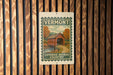 A vintage-style sign for Vermont's Covered Bridge Country, featuring a wooden bridge and autumn foliage, is displayed on a wooden wall.