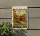 A sign for Vermont's Covered Bridge Country, featuring a wooden bridge and autumn foliage.