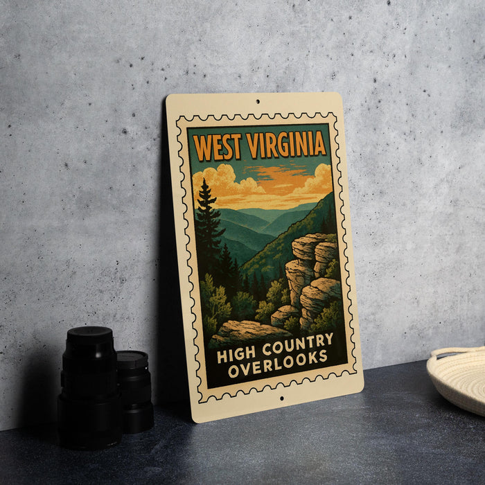 A vintage-style metal sign with the text "WEST VIRGINIA" and "HIGH COUNTRY OVERLOOKS" is displayed on a gray wall, along with a stack of black camera lenses and a white dish.