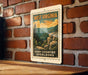 A vintage-style metal sign with the text "WEST VIRGINIA HIGH COUNTRY OVERLOOKS" is displayed on a brick wall.