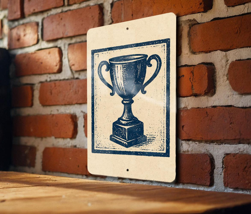 A sign featuring a blue trophy on a wooden surface against a brick wall background.