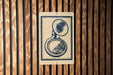 a brass instrument, specifically a tuba, which is depicted on a sign.