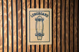 A sign with the word "LONGBOARD" and a graphic of a skateboard is displayed on a wooden wall.