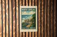 A metal sign with a vintage-style illustration of a beach and ocean, mounted on a wooden wall.
