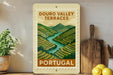 a poster or sign for the Douro Valley Terraces in Portugal, with a scenic illustration of the valley and a river.