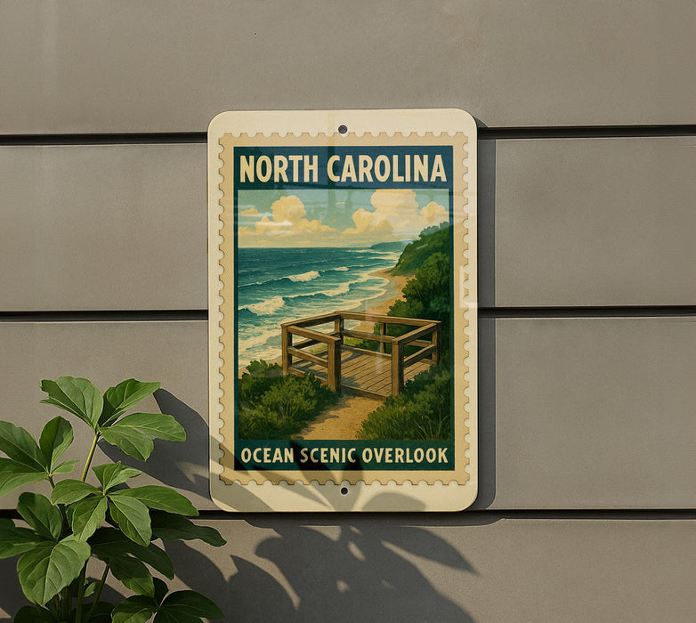 A sign for the North Carolina Ocean Scenic overlook, featuring a scenic image of the ocean and a wooden walkway leading to the overlook.