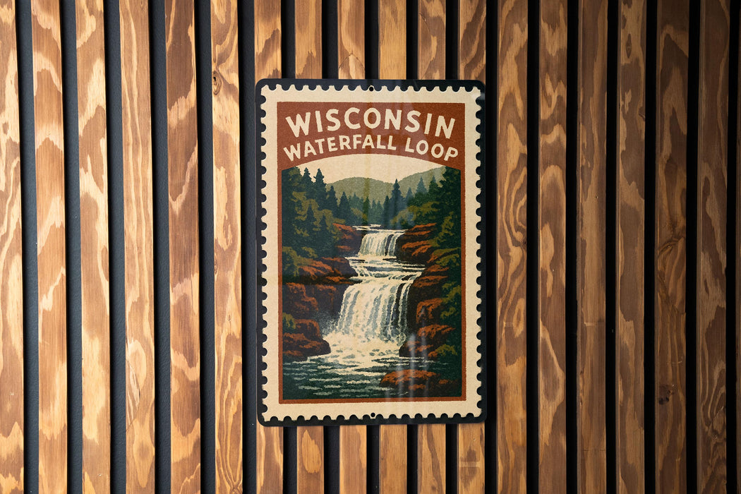 A vintage-style poster of Wisconsin's Waterfall Loop is displayed on a wooden wall.
