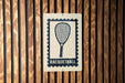 A sign with a racquet and the word "RACQUETBALL" printed on it is displayed on a wooden wall.