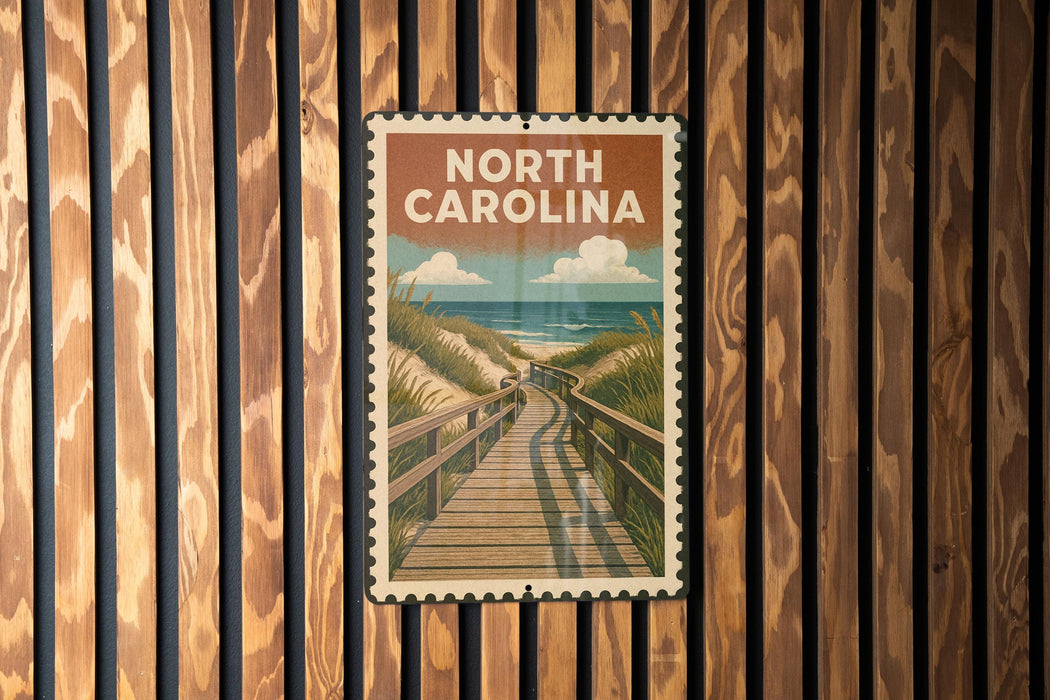 A vintage-style poster of a wooden boardwalk leading to a beach is displayed on a wooden wall.