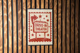 A sign that reads "DRIVE-IN THEATER" is displayed on a wooden wall.