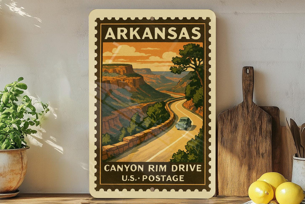 A vintage-style postage stamp from Arkansas depicting a scenic road leading to a canyon, with a car driving along the road.