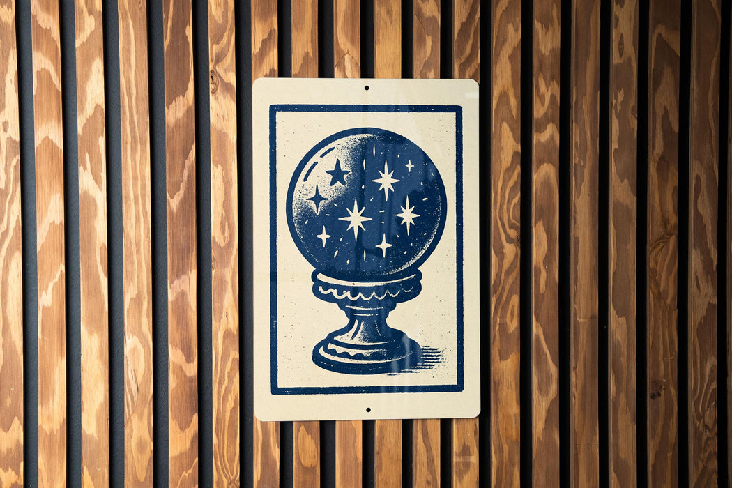 a sign with a blue and white design, depicting a starry night sky on a white background.