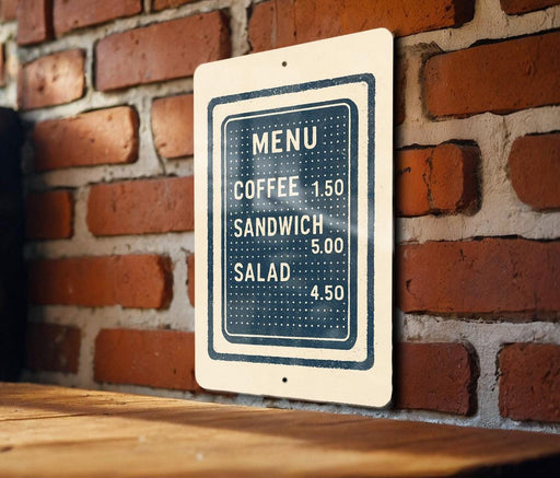 A menu sign is hanging on a brick wall, providing information about the available food and drink items.