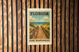 A sign for Florida Dune Boardwalks is displayed on a wooden wall.