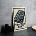 A metal sign with a black and white design, featuring the text "WOV'T YREISG ALB M NKU C ZXCI" and the phrase "TYP E SLUG TRAY".