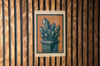 a sign with a stylized illustration of a crystal formation on a wooden background.