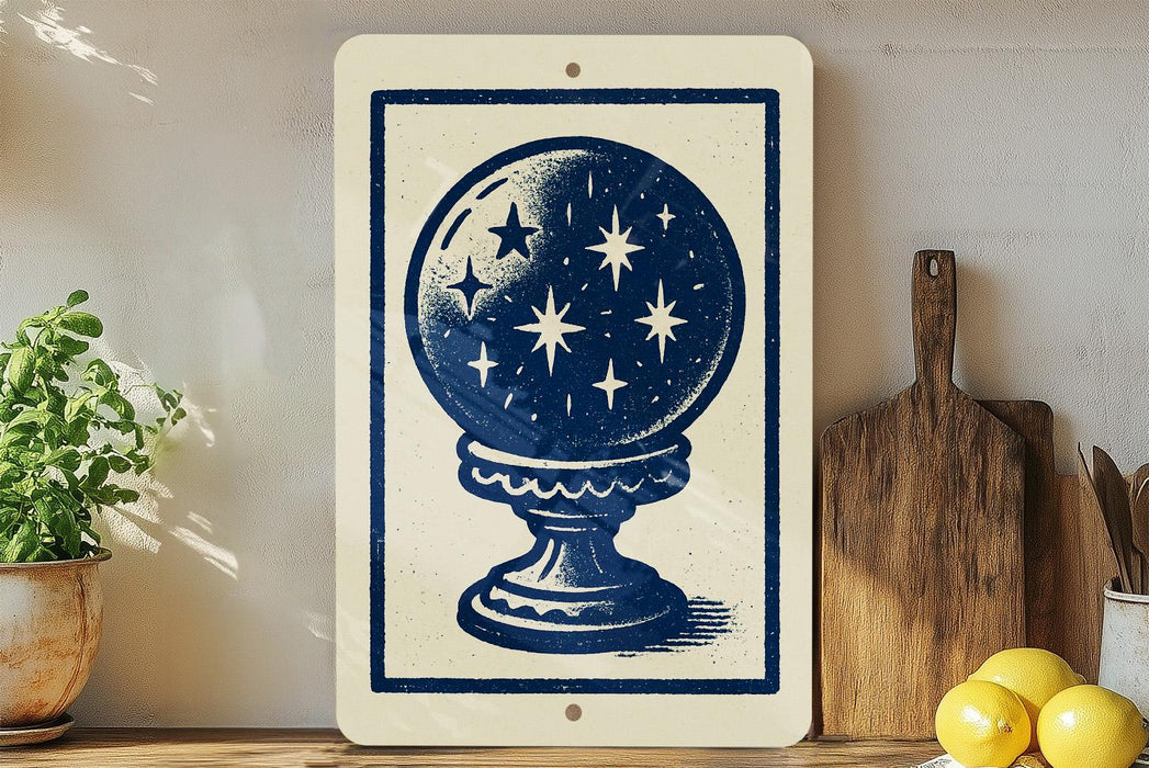a white sign with a blue illustration of a starry globe, placed on a wooden surface next to a wooden cutting board and a potted plant.