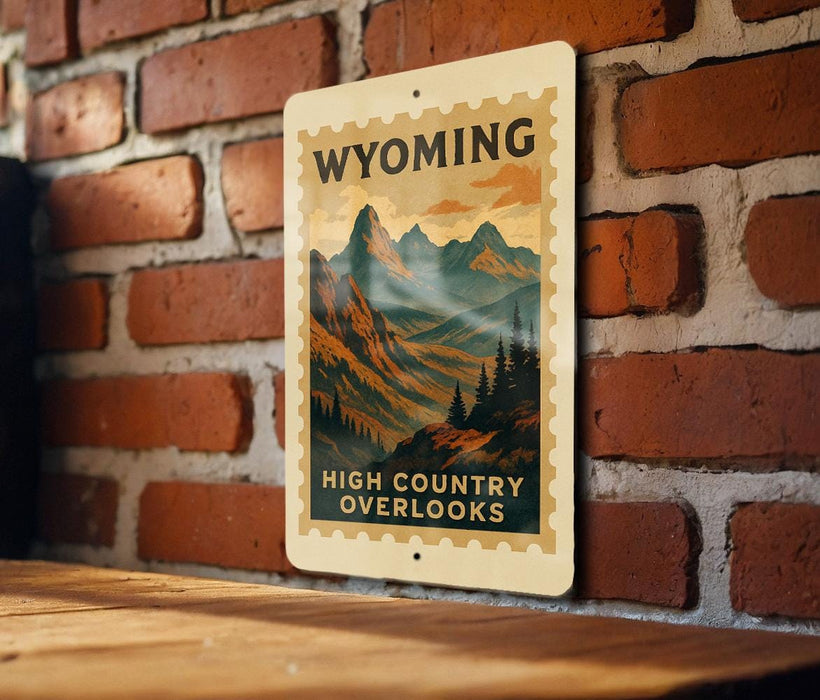 A metal sign with a mountain landscape and the text "Wyoming High Country Overlooks" is displayed on a brick wall.