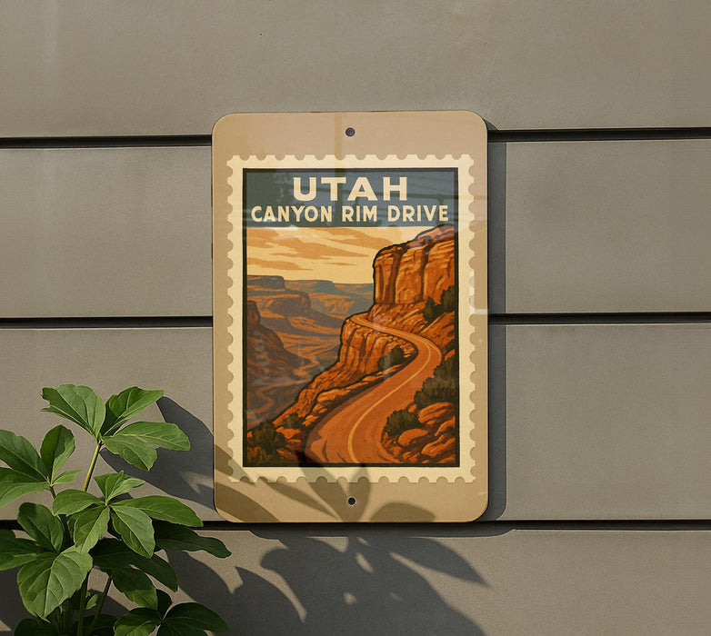 A sign for Utah Canyon Rim Drive, featuring a scenic illustration of the canyon landscape.
