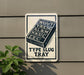 a sign with the text "Type Slug Tray" and an illustration of a slug on a tray.