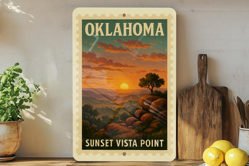 A framed poster of a sunset landscape with mountains and trees, titled "OKLAHOMA" and "SUNSET Vista Point", is displayed on a shelf next to a wooden cutting board and a potted plant.